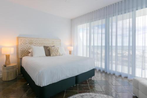 Katil atau katil-katil dalam bilik di Sea View - Family - Beach Access - 4 Bed 3 Bath