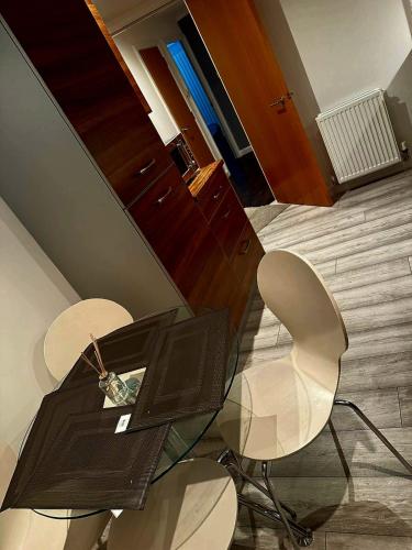 a room with two chairs and a table and a desk at Luxury 2 bedroom apartment in Aberdeen in Kirkton of Skene