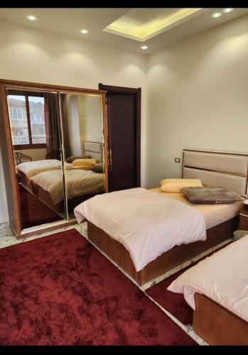 Postel nebo postele na pokoji v ubytování HOTEL Habib front Mansoura University Private