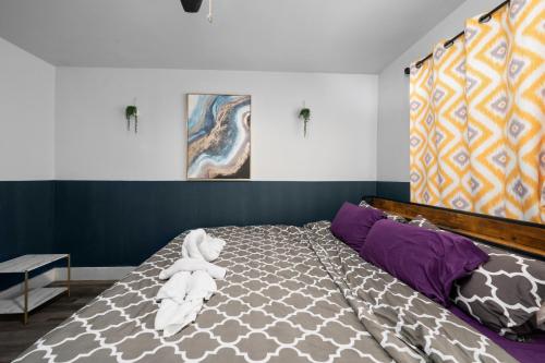 a bedroom with a bed with towels on it at Quirky 1BR Near NRG Stadium & Medical Center in Houston