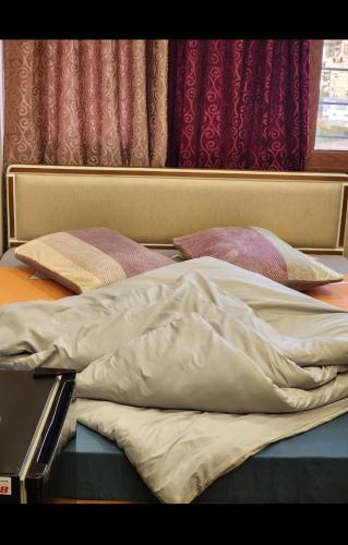 Postel nebo postele na pokoji v ubytování HOTEL Habib front Mansoura University Private