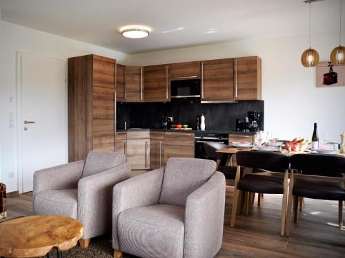 a kitchen and dining room with a table and chairs at Bergblick in Werfenweng