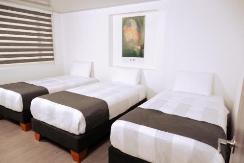 Postel nebo postele na pokoji v ubytování Hotel Montefiore