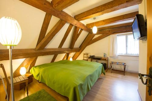 Tempat tidur dalam kamar di Landgasthof Ochsen
