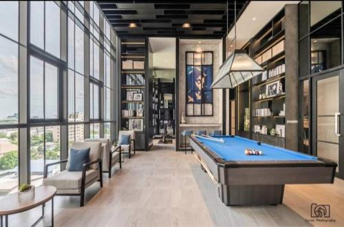 a billiard room with a pool table and chairs at Luxury condo in Bangkok,NearBTSMochit,MRTChatuchak in Bangkok