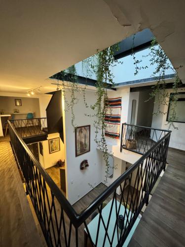 a view from the top of a balcony of a house at Calzolli Penthouse Casa de Huéspedes y Coliving in Mexico City
