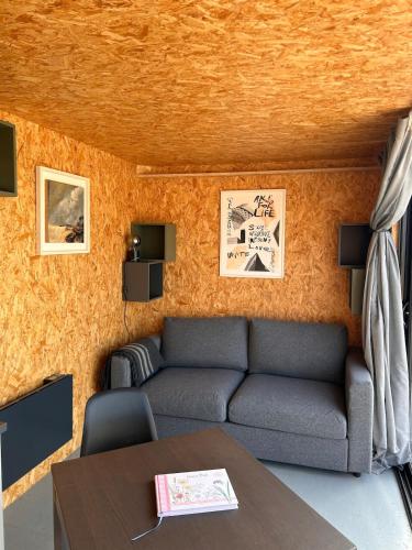 a living room with a couch and a table at The 9 acre in Midleton
