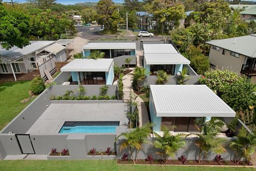 an aerial view of a house with a swimming pool at Cavvanbah - Rio Villa - Construction Zone Warning in Byron Bay