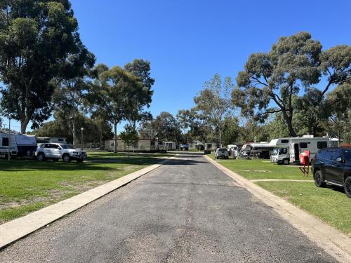 an empty road at an rv park with parked cars at Young Caravan and Tourist Park in Young