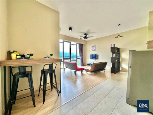 a kitchen and living room with a table and chairs at Austin Cube 8 Teens by RR JBcity in Johor Bahru