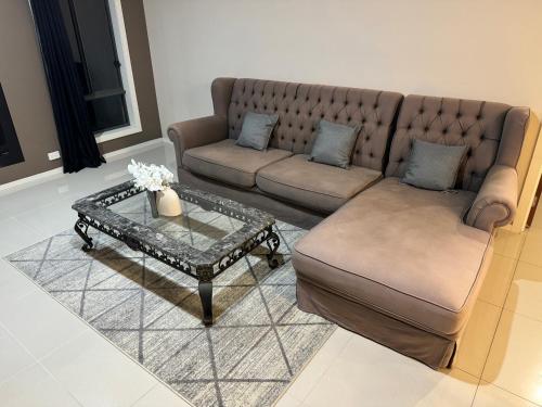 a living room with a couch and a coffee table at Cozy family home near suft coast 6 beds in Grovedale