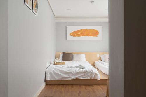 Кровать или кровати в номере Dawoo House 2 in Hongdae
