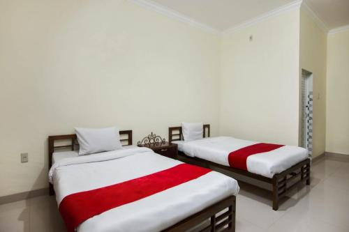 Ένα ή περισσότερα κρεβάτια σε δωμάτιο στο Esther Hotel