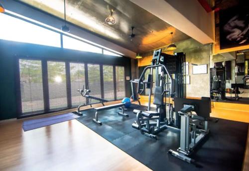 a gym with treadmills and machines in a room at Austin Cube 8 Teens by RR JBcity in Johor Bahru