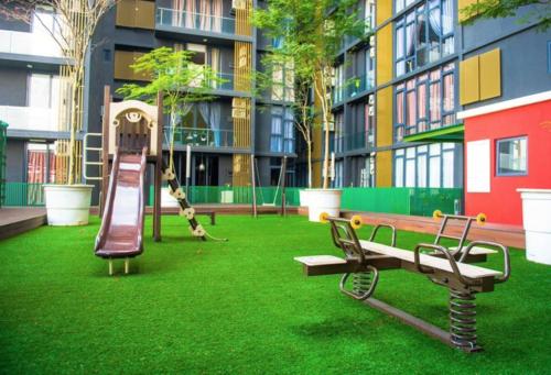 a park with a playground with a slide and a swing at Austin Cube 8 Teens by RR JBcity in Johor Bahru