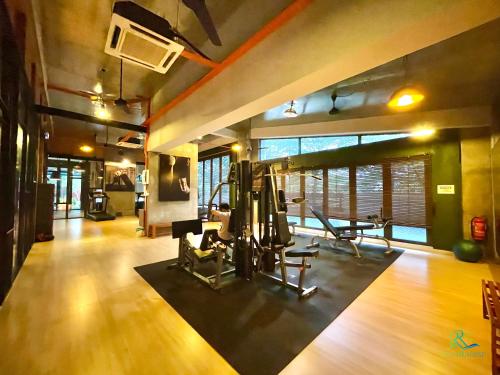 a gym with treadmills and ellipticals in a room at Austin Cube 8 Teens by RR JBcity in Johor Bahru