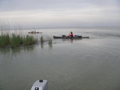 a person in a boat on a body of water at Albergo Italia in Porto Tolle