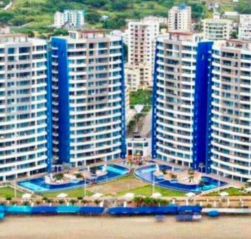 a group of tall buildings in a city at GRAND DIAMOND BEACH Tonsupa Atacames in Tonsupa