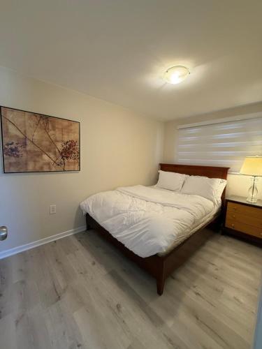 Voodi või voodid majutusasutuse Niagra Luxury Home toas