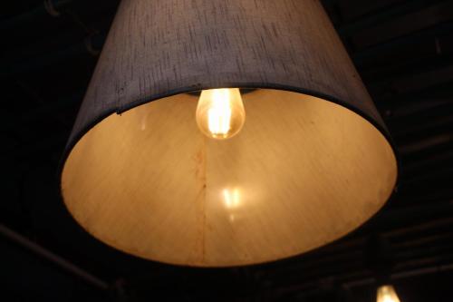 a light fixture hanging from the ceiling of a room at Munnar Kudil Resto Cafe in Anaviratty