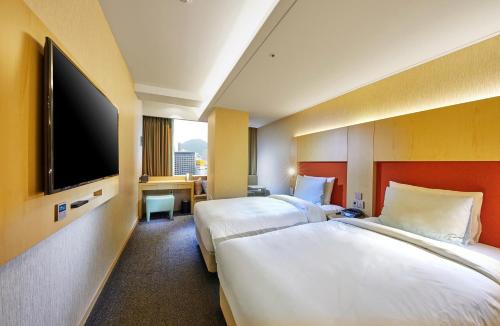 Hotel Midcity Myeongdongにあるベッド