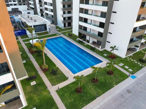 an overhead view of a swimming pool in a building at Charming apartment 3 minutes from the beach in Mazatlán
