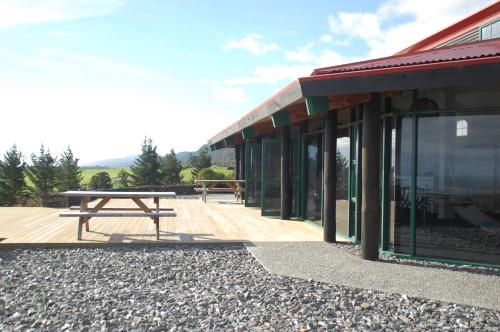 a picnic table sitting outside of a building at Rataview in Barrytown