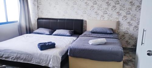 Ένα ή περισσότερα κρεβάτια σε δωμάτιο στο Premium Regency Tanjung Tuan - Idealhub