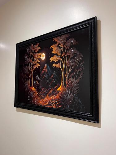 a picture of a painting on a wall at Hotel soumya sarovar in Jagdalpur