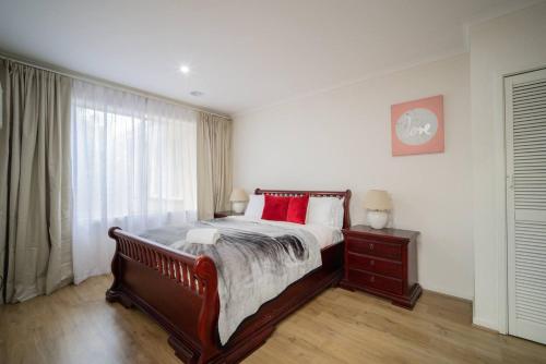 a bedroom with a large bed and a window at Devon Meadows Farm Escape in Devon Meadows
