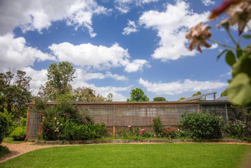 a brick building with a garden in front of it at Devon Meadows Farm Escape in Devon Meadows
