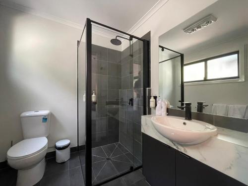 a bathroom with a sink and a toilet at BIG4 Yarra Valley Park Lane Holiday Park in Healesville