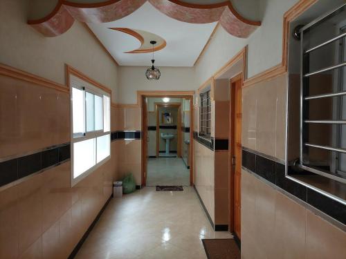 a hallway with a coffered ceiling and a hallway with a hallway at Cozy Al Hoceima Apt, Near Beach in Al Hoceïma