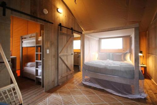 a bedroom with a bed inside of a room at BIG4 Yarra Valley Park Lane Holiday Park in Healesville