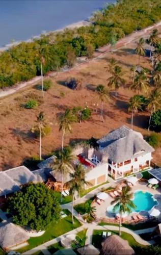 an aerial view of a resort with a swimming pool at Kirepwe Ecco Camp Watamu in Watamu