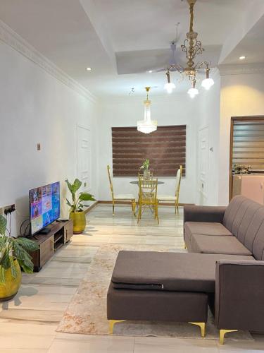 a living room with a couch and a table at Ayaa Grace in Accra