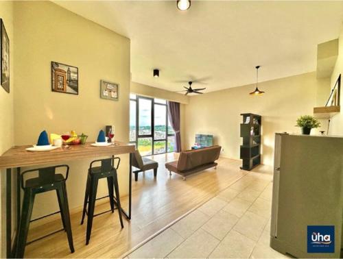 a kitchen and living room with a table and chairs at Austin Cube 8 Teens by RR JBcity in Johor Bahru