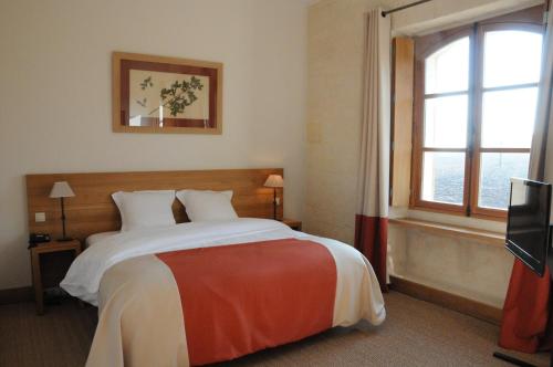 Ένα ή περισσότερα κρεβάτια σε δωμάτιο στο Le Clos Barisseuse