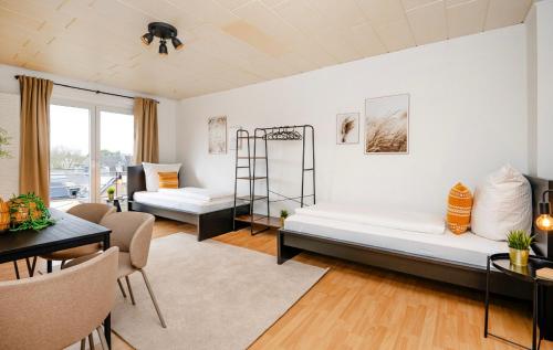 En eller flere senge i et værelse på Gemütliche 2 Zimmerwohnung für 4