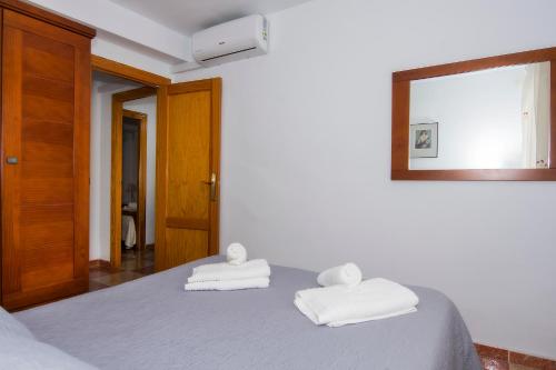 Ένα ή περισσότερα κρεβάτια σε δωμάτιο στο Apartamentos Sol Andaluz
