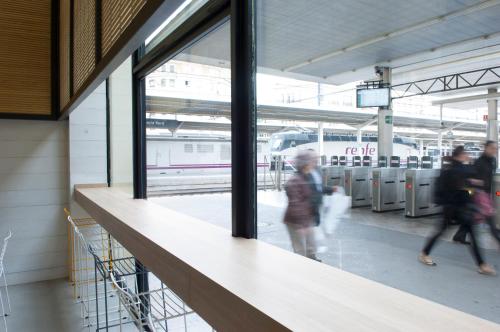 a group of people walking in a train station at UP Hostel Valencia in Valencia
