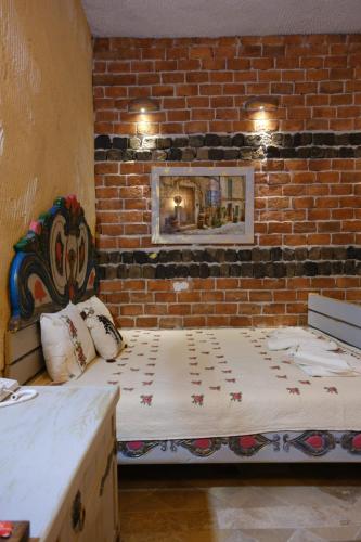 Aşk-ı Nare Cave Hotel - Swimming Pool & SPAにあるベッド