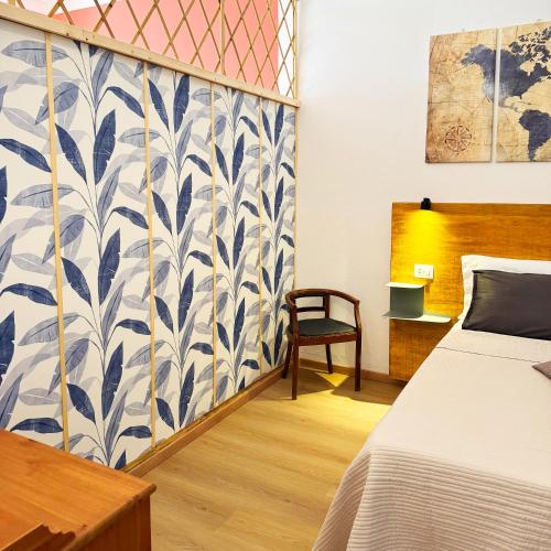 a bedroom with a bed and a wall with a mural at Vista Lago - Lake Como collection in Domaso