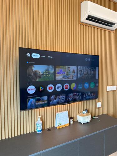 a flat screen tv hanging on a wall at Seri Kembangan Metacity, Cikgu Kabinet Empire, Equine Park,MRT Station, IOI mall, Putrajaya, Cyberjaya, Farm in the city, Uptown Equine in Seri Kembangan