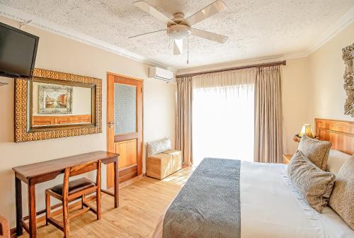 Ένα ή περισσότερα κρεβάτια σε δωμάτιο στο Sunward Park Guest House & Conference Center