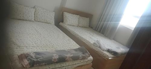 Una cama o camas en una habitación de DINO Home HACOM 2BR 2WC