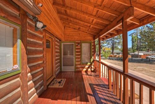 a porch of a log cabin with wooden walls at Brother Bear Cabin in Big Bear City