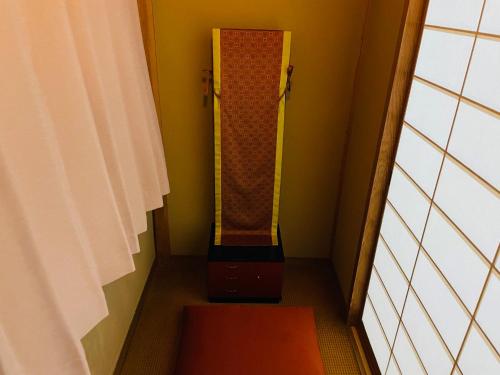 a room with a stairwell with a suitcase in it at Hotel Clio Court Hakata in Fukuoka