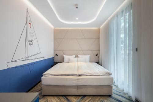 a bedroom with a bed with a sail on the wall at Donautica Hotel & Restaurant in Fadd-Dombori