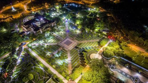 an overhead view of a park at night with lights at Pintarman Family Suites 3 at MTS Family Unit in Miri